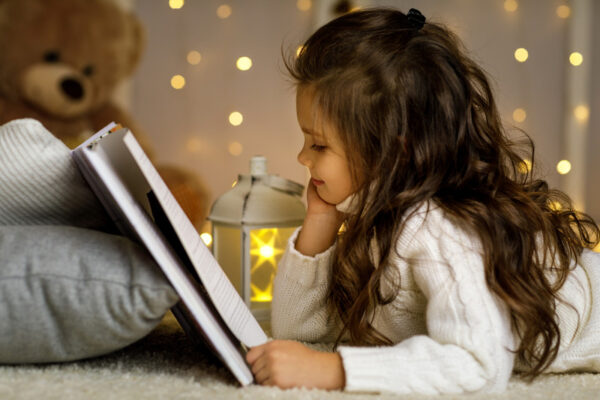 child girl is reading book